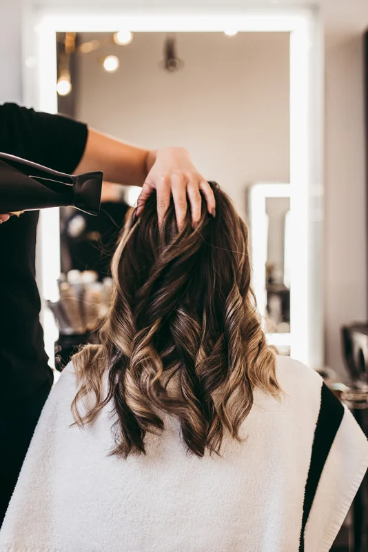 Client hair being styled.